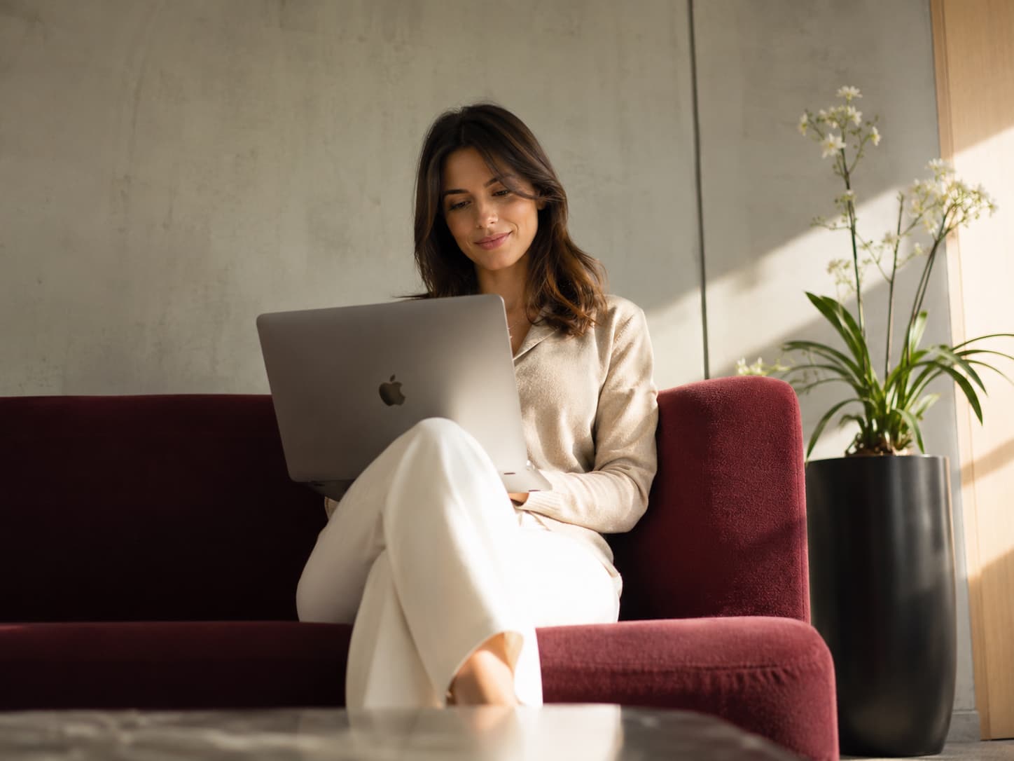 Founder working on a laptop in an office lounge